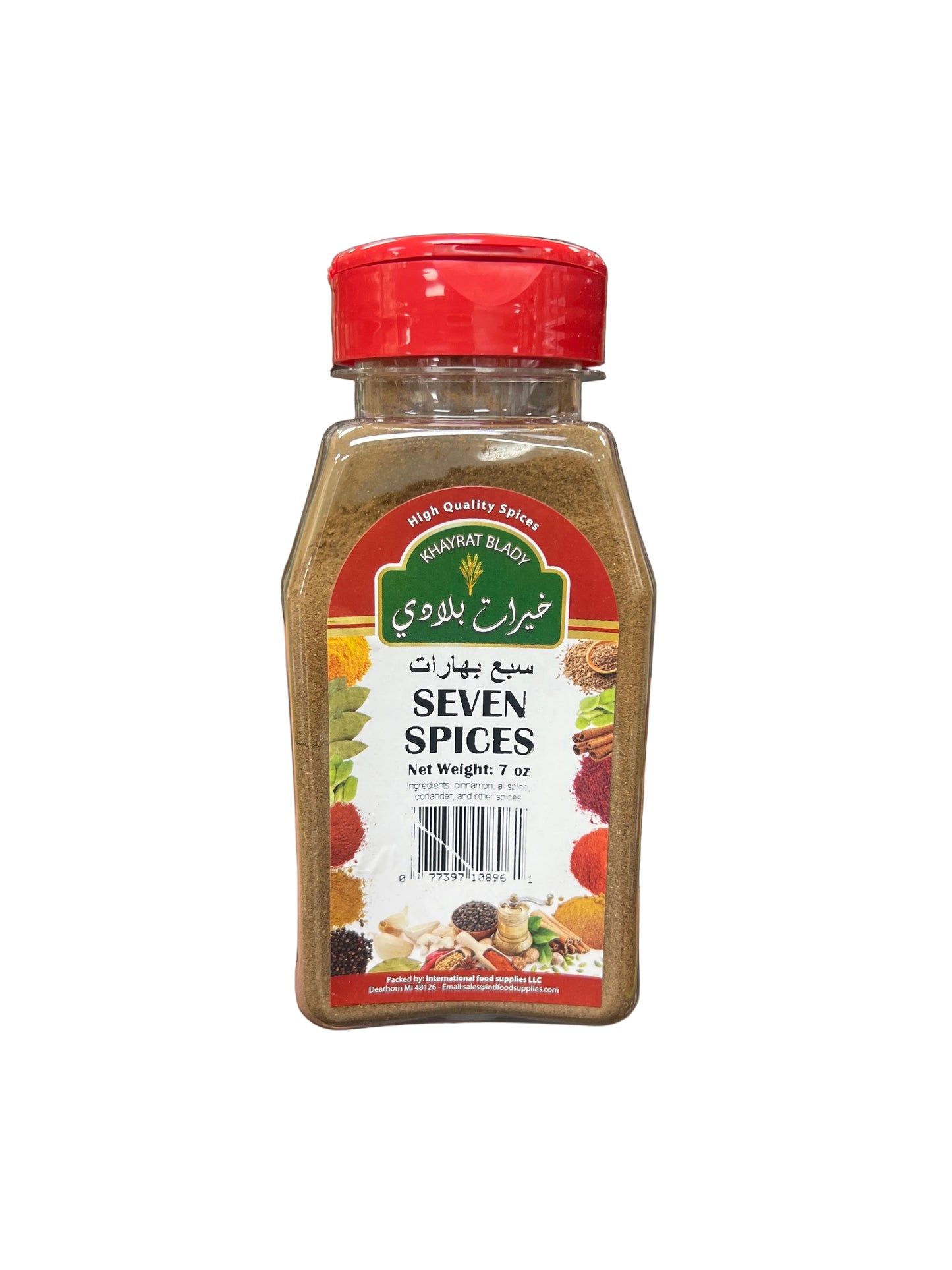 Hand holding a bottle of 'Seven Spices' in a grocery store aisle.