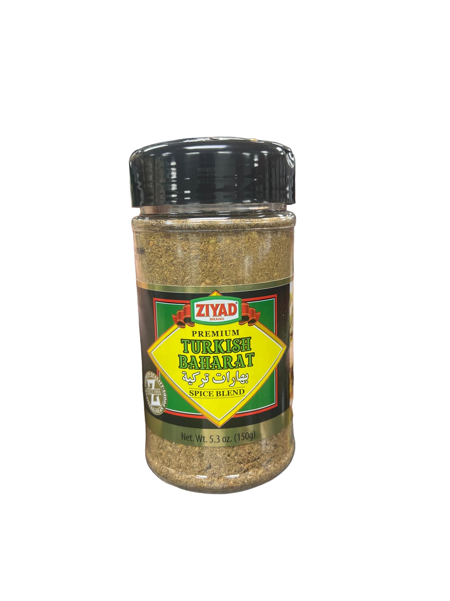 Hand holding a spice jar labeled 'Ziyad' in a grocery store aisle.