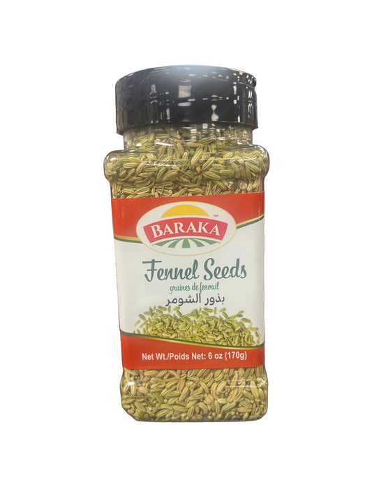 Hand holding a package of Baraka fennel seeds in a grocery store setting