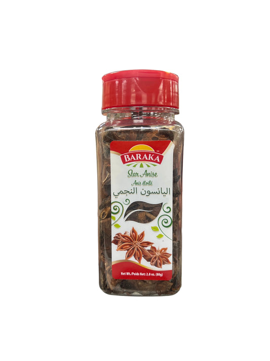 Hand holding a bottle of Baraka spices in a grocery store aisle.