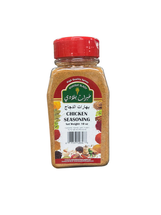 Hand holding a jar of chicken seasoning in a grocery store aisle