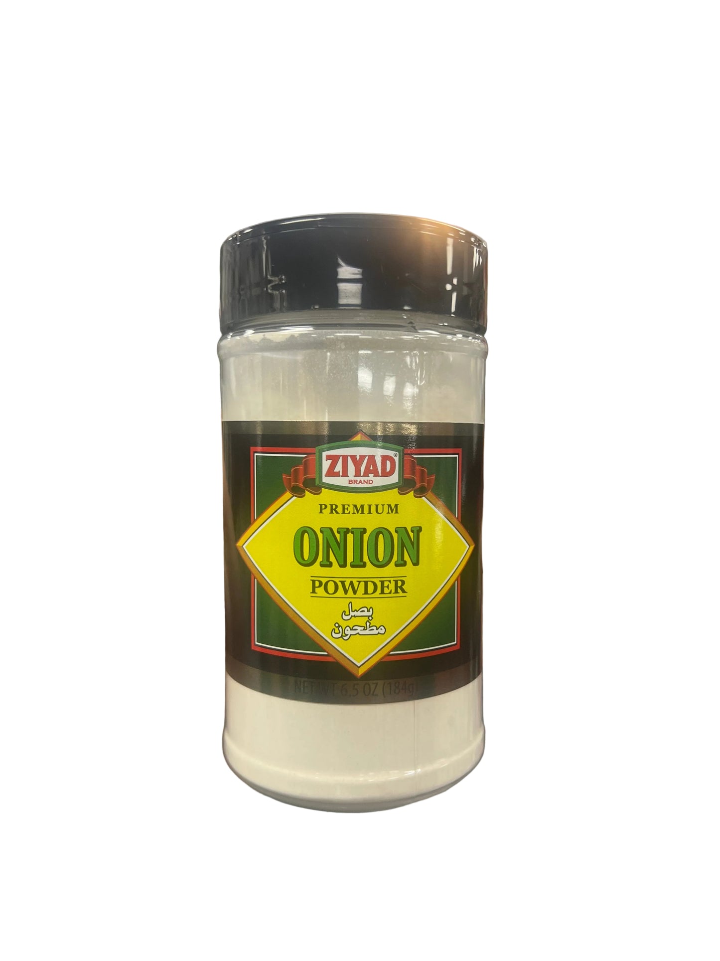 Hand holding a container of Ziyad Premium Onion Powder in a grocery store aisle.