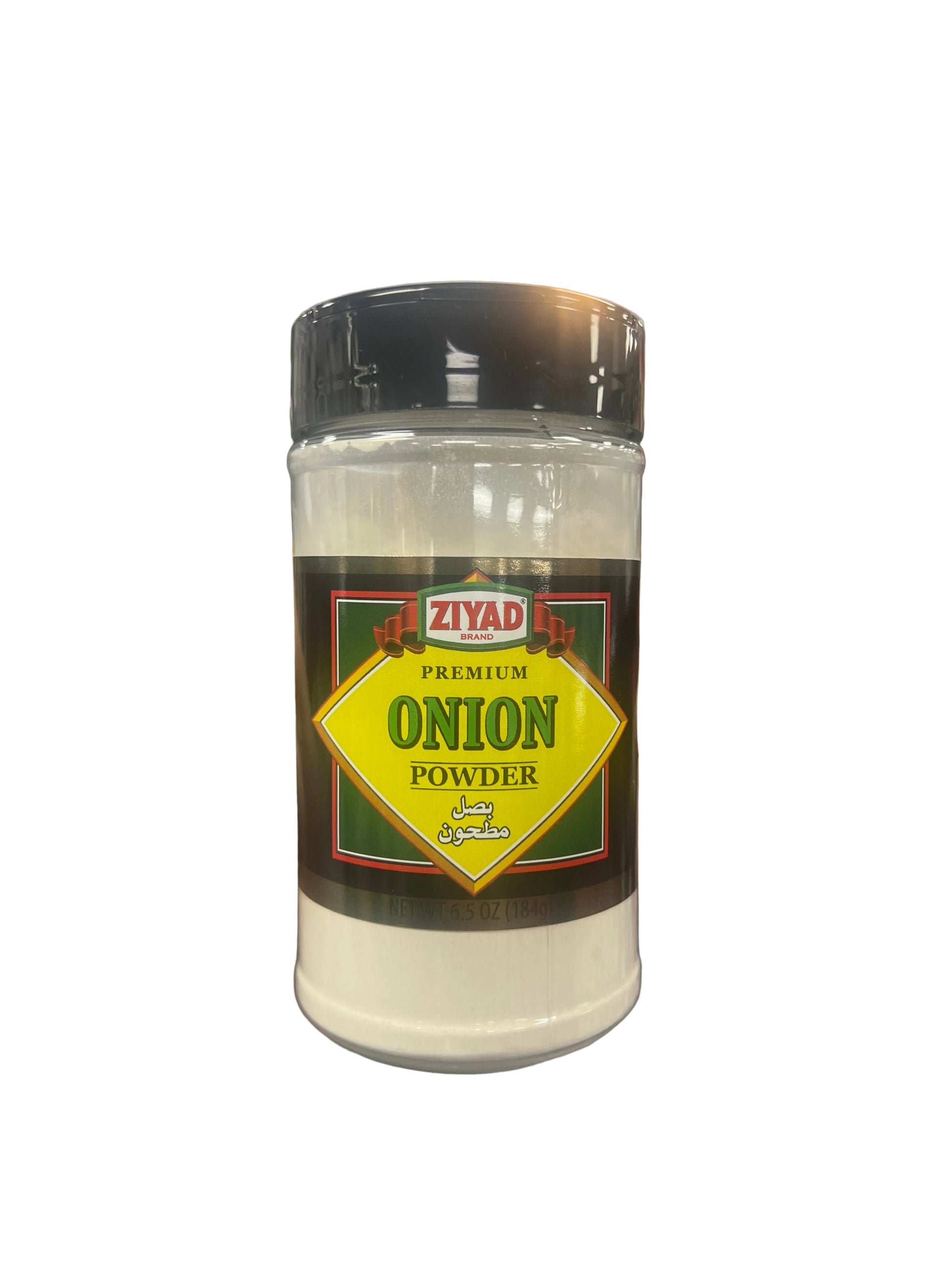Hand holding a container of Ziyad Premium Onion Powder in a grocery store aisle.