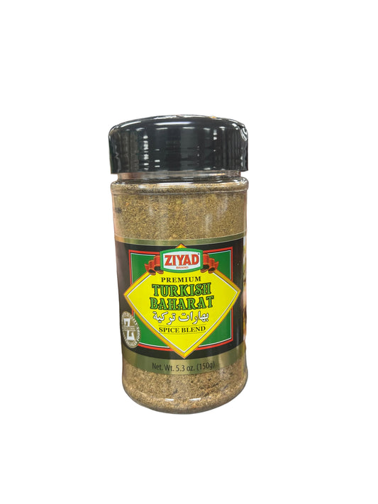 Hand holding a spice jar labeled 'Ziyad' in a grocery store aisle.