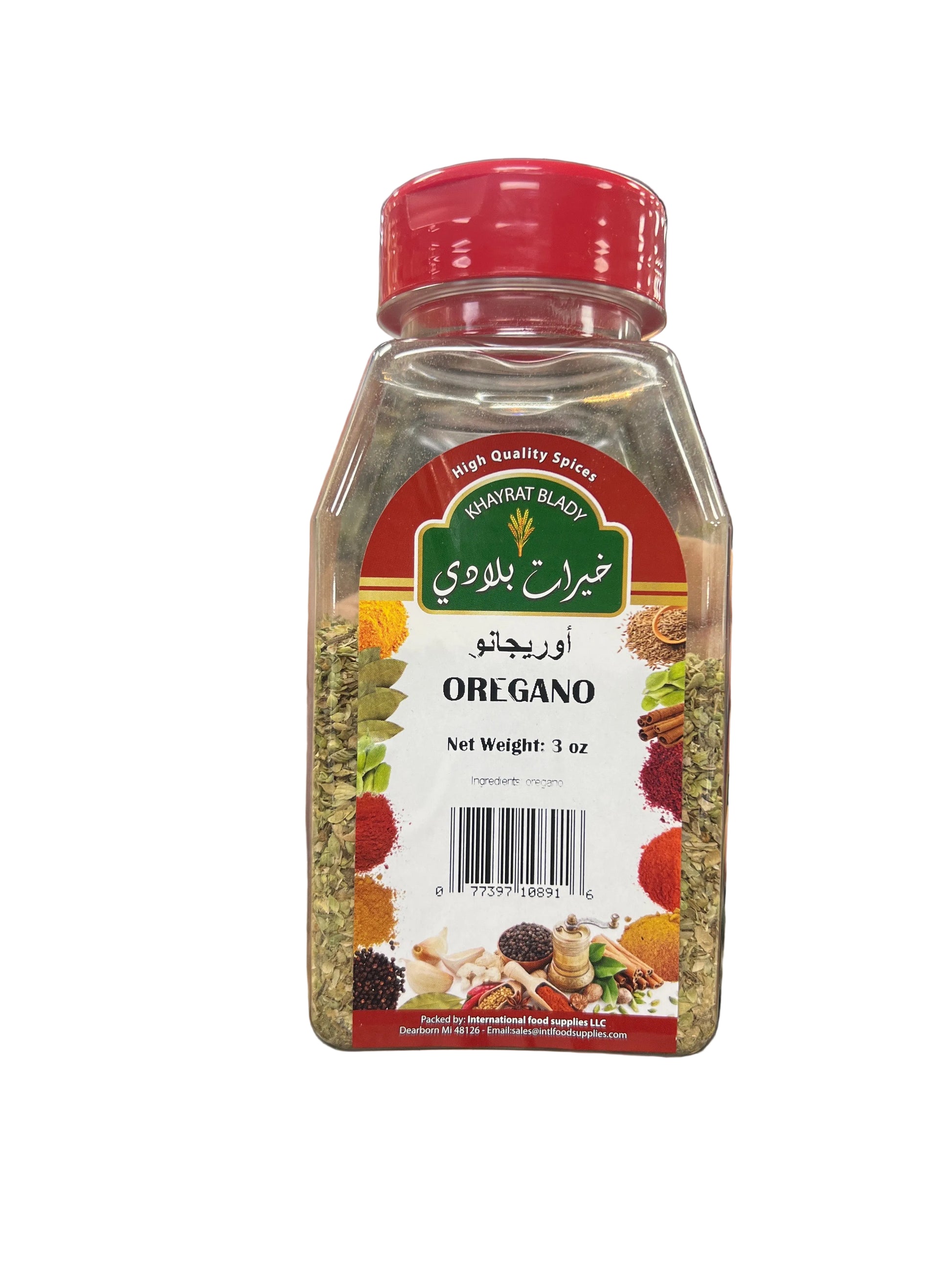 Hand holding a container of oregano with a blurred grocery store background